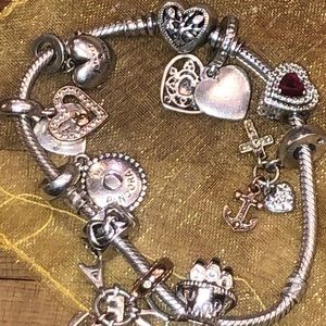 7”. Charm bracelet by PANDORA. Loaded with 9 charms!